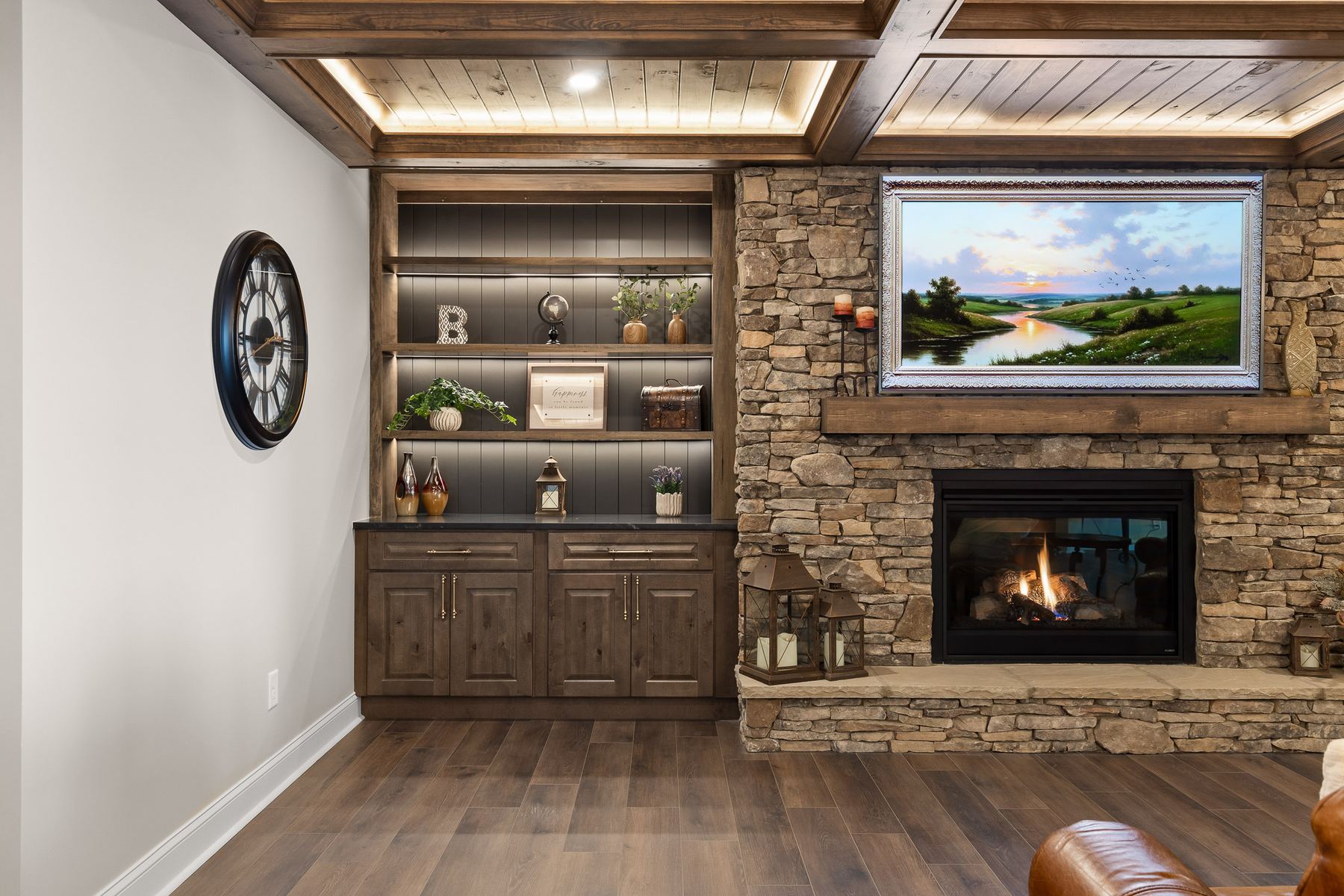 Stone fireplace custom built-ins basement remodel